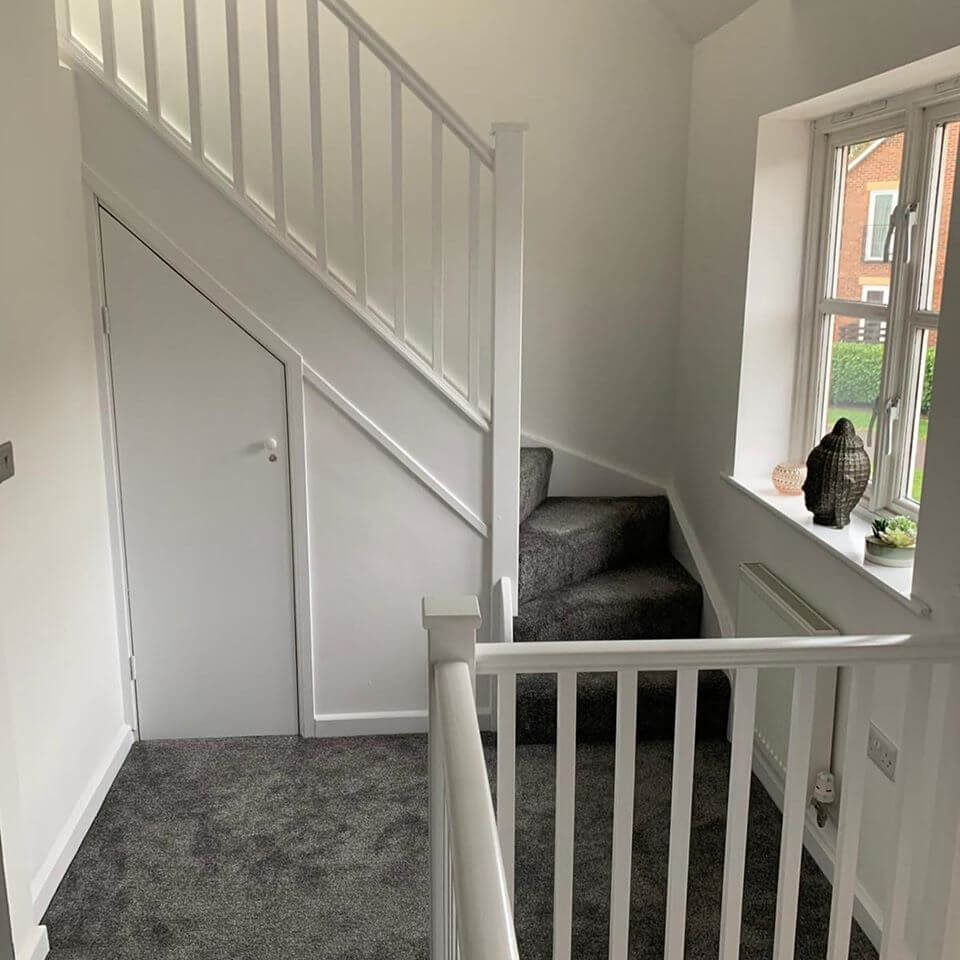 Staircase with grey carpet